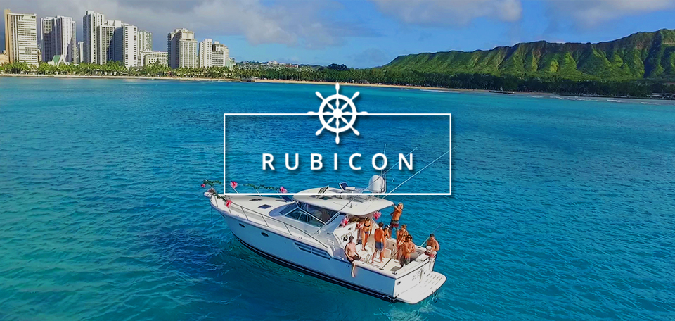 Rubicon text over the Rubicon yacht floating off shore